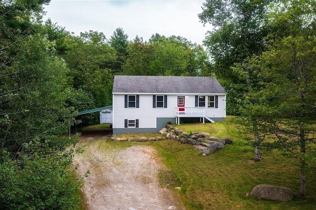 7 Lucas Ct, Bristol, ME 04539 - single story home with driveway, a carport, and a forest view