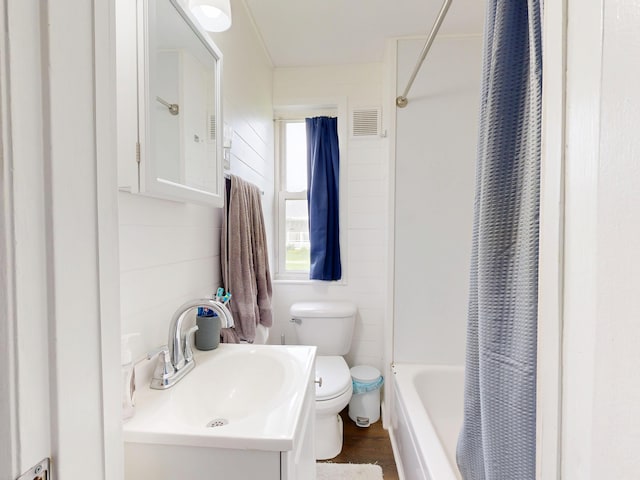 28 Stewart St, Lewiston, ME 04240 - bathroom with vanity, shower / bath combination with curtain, and wood finished floors