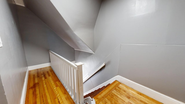 28 Stewart St, Lewiston, ME 04240 - stairs featuring hardwood / wood-style floors and baseboards
