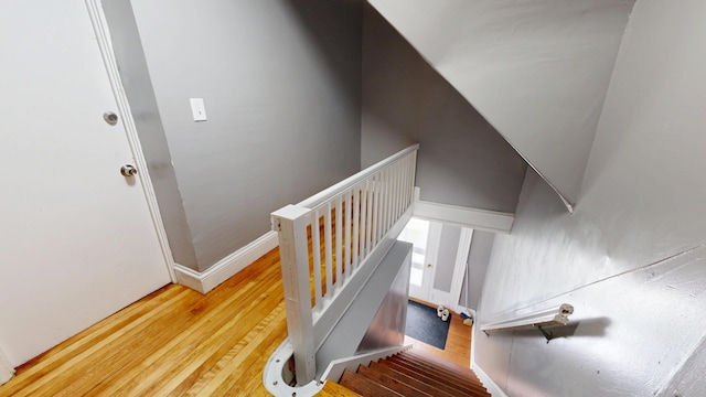 28 Stewart St, Lewiston, ME 04240 - staircase featuring wood-type flooring