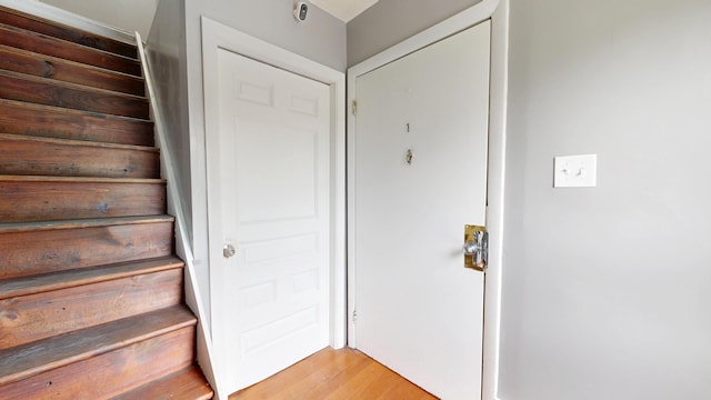 28 Stewart St, Lewiston, ME 04240 - staircase featuring wood finished floors