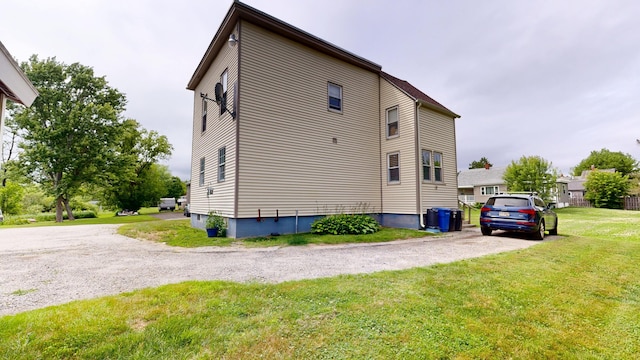 28 Stewart St, Lewiston, ME 04240 - view of property exterior with a lawn and driveway