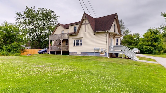 28 Stewart St, Lewiston, ME 04240 - rear view of house featuring a yard and roof with shingles