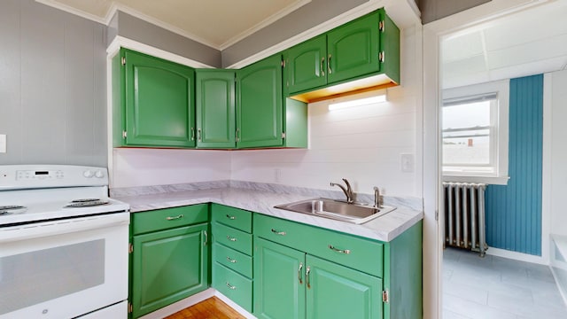 28 Stewart St, Lewiston, ME 04240 - kitchen featuring white electric range oven, radiator heating unit, light countertops, ornamental molding, and light tile patterned floors