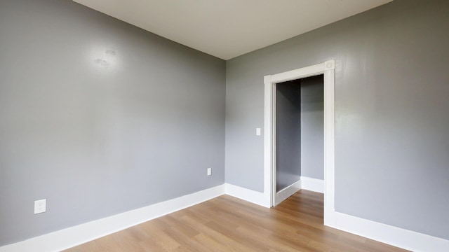 28 Stewart St, Lewiston, ME 04240 - empty room with light wood-style flooring and baseboards