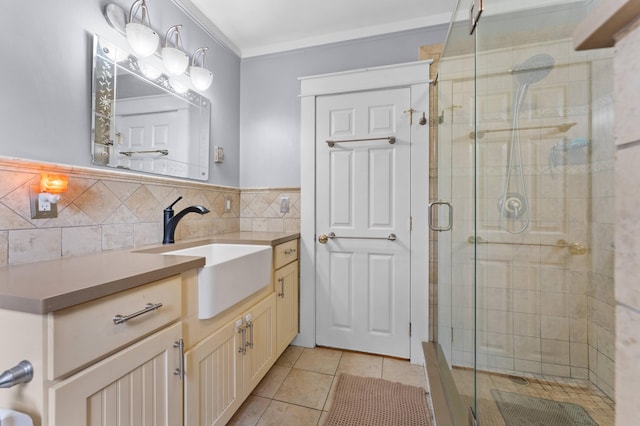 118 Gore Rd, Palermo, ME 04354 - bathroom with vanity, a shower stall, tile patterned flooring, and ornamental molding