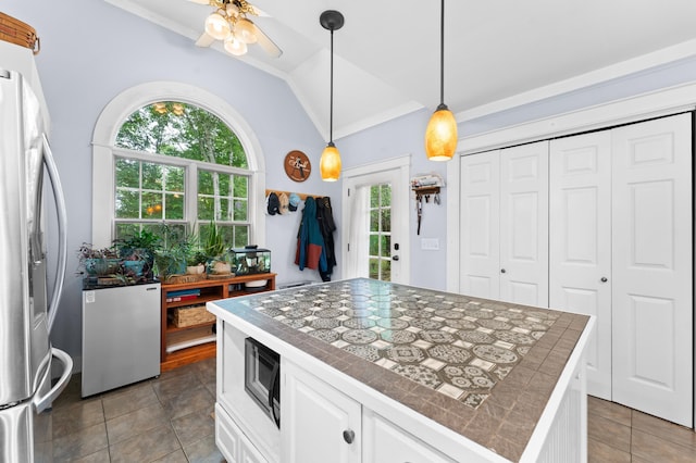 118 Gore Rd, Palermo, ME 04354 - kitchen featuring lofted ceiling, stainless steel refrigerator with ice dispenser, fridge, white cabinets, and a ceiling fan