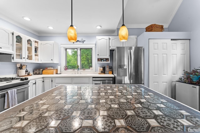 118 Gore Rd, Palermo, ME 04354 - kitchen with crown molding, stainless steel appliances, white cabinets, glass insert cabinets, and pendant lighting