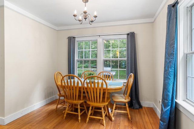 118 Gore Rd, Palermo, ME 04354 - dining room featuring a chandelier, ornamental molding, and light wood-style floors