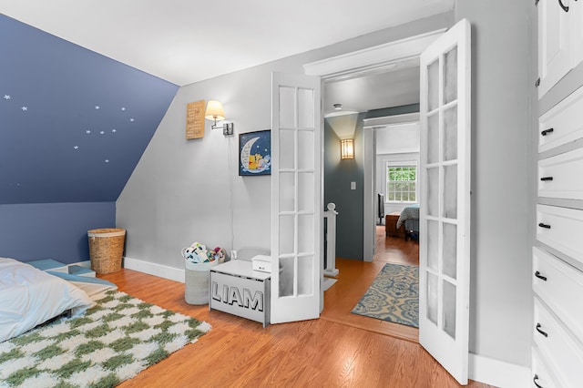118 Gore Rd, Palermo, ME 04354 - bedroom featuring light wood-type flooring and lofted ceiling