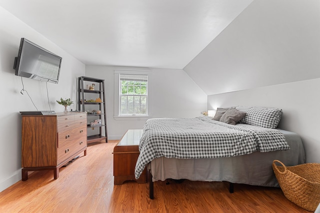 118 Gore Rd, Palermo, ME 04354 - bedroom featuring light wood finished floors and lofted ceiling
