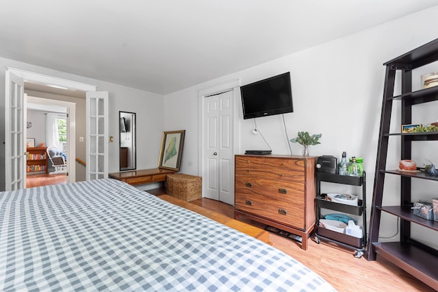 118 Gore Rd, Palermo, ME 04354 - bedroom featuring wood finished floors, french doors, and a closet