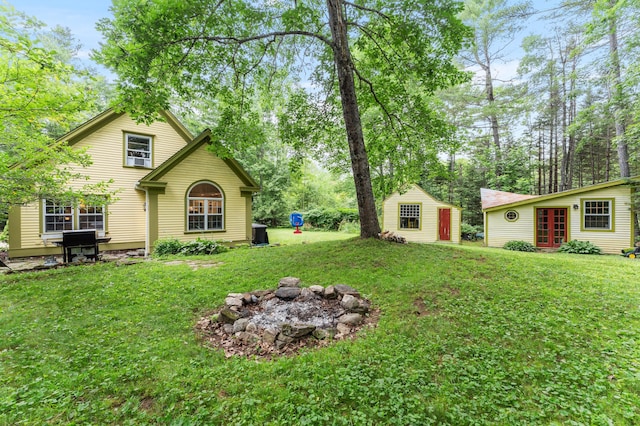 118 Gore Rd, Palermo, ME 04354 - view of green lawn featuring french doors and a fire pit