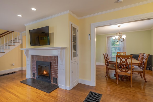 135 State Highway 3, Bar Harbor, ME 04609 - living room with wood finished floors, crown molding, stairs, a chandelier, and recessed lighting