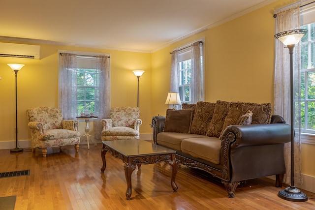 135 State Highway 3, Bar Harbor, ME 04609 - living area featuring healthy amount of natural light, crown molding, hardwood / wood-style flooring, and a wall unit AC