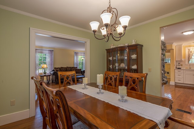 135 State Highway 3, Bar Harbor, ME 04609 - dining room with a chandelier, ornamental molding, and dark wood finished floors