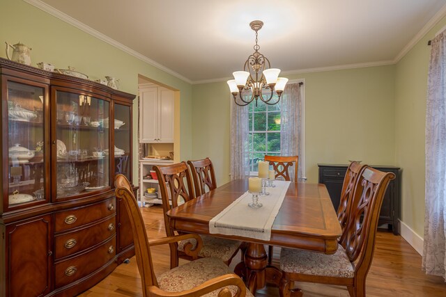 135 State Highway 3, Bar Harbor, ME 04609 - dining space featuring a chandelier, light wood finished floors, and crown molding