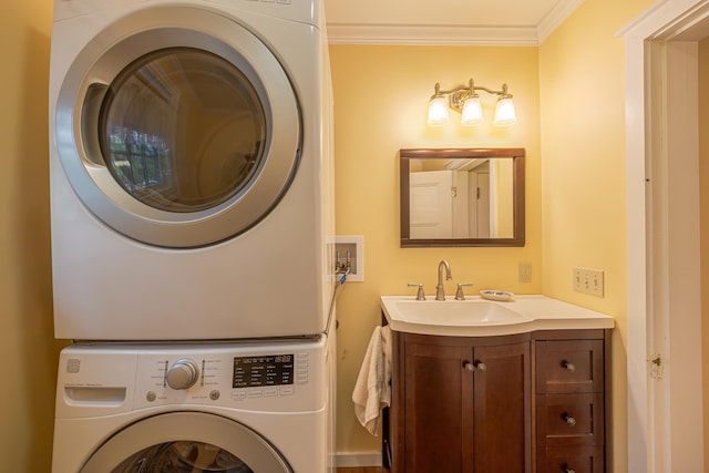 135 State Highway 3, Bar Harbor, ME 04609 - laundry area featuring estacked washer and dryer and crown molding