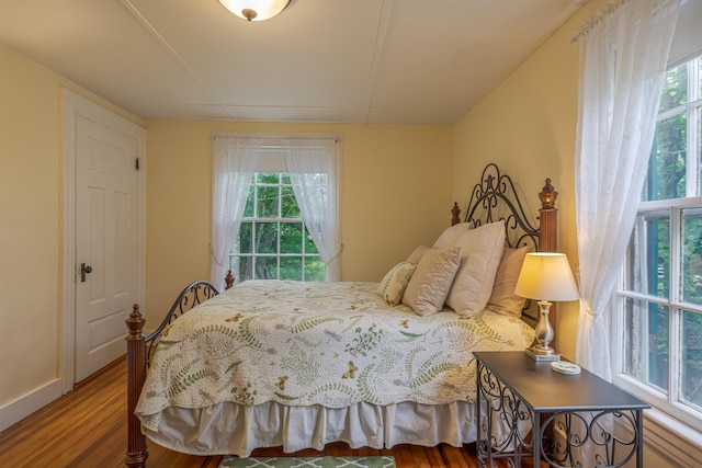 135 State Highway 3, Bar Harbor, ME 04609 - bedroom featuring wood finished floors and multiple windows