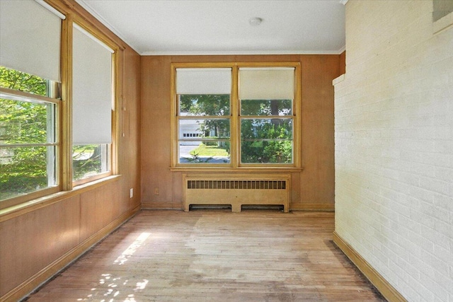49 Bardwell St, Lewiston, ME 04240 - unfurnished room with radiator heating unit, wood finished floors, and ornamental molding