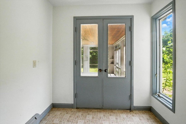 49 Bardwell St, Lewiston, ME 04240 - doorway to outside with french doors and baseboards