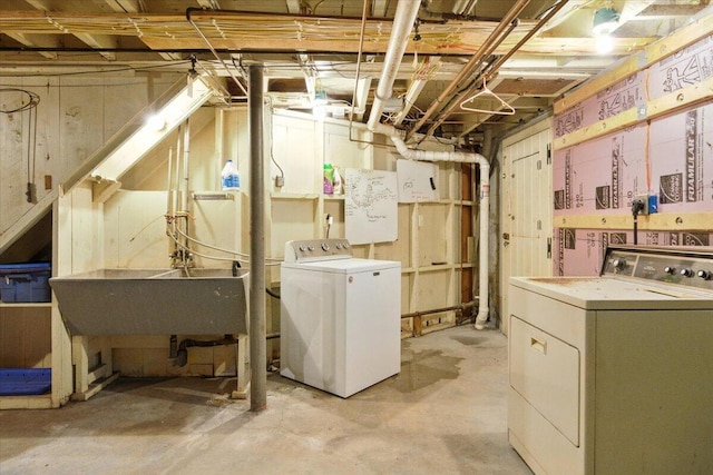 49 Bardwell St, Lewiston, ME 04240 - unfinished below grade area with washing machine and dryer and a sink