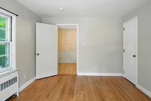 49 Bardwell St, Lewiston, ME 04240 - unfurnished bedroom featuring radiator and wood finished floors
