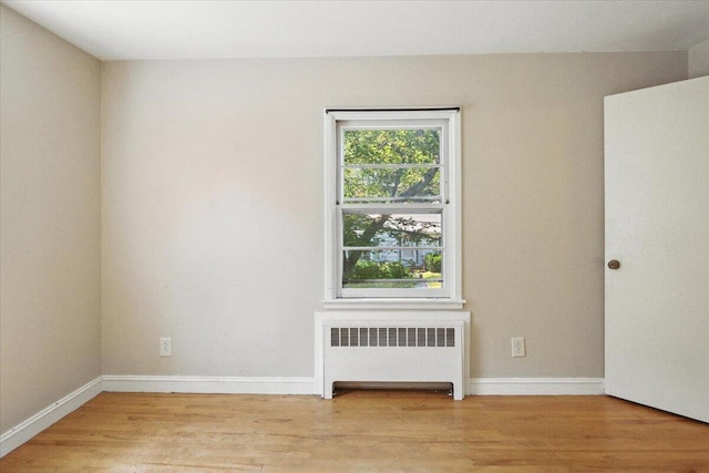 49 Bardwell St, Lewiston, ME 04240 - unfurnished room with radiator heating unit and light wood-type flooring
