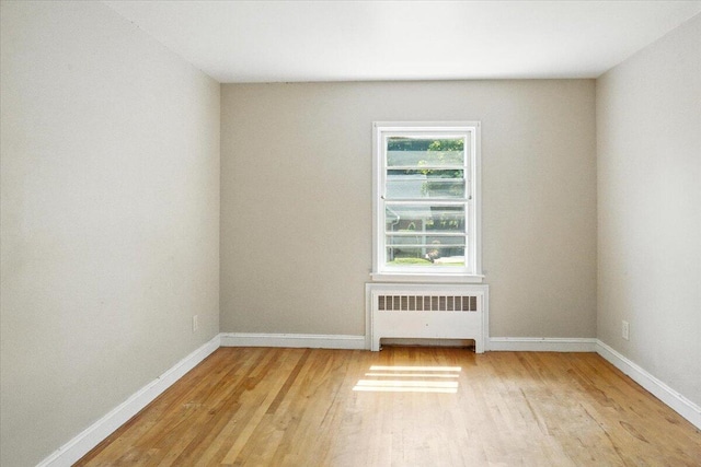 49 Bardwell St, Lewiston, ME 04240 - unfurnished room with radiator and light wood-style flooring