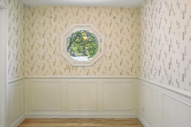 49 Bardwell St, Lewiston, ME 04240 - detailed view of wallpapered walls, wood finished floors, and a wainscoted wall