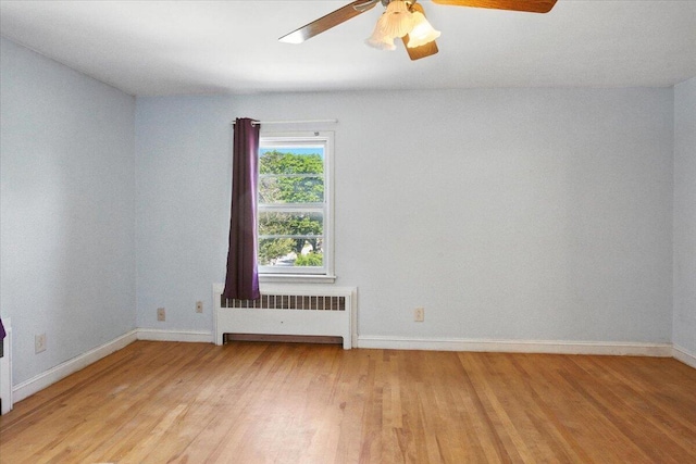 49 Bardwell St, Lewiston, ME 04240 - empty room featuring radiator, light wood finished floors, and a ceiling fan