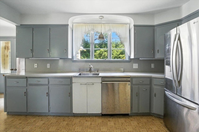 49 Bardwell St, Lewiston, ME 04240 - kitchen with appliances with stainless steel finishes, gray cabinetry, light countertops, and backsplash