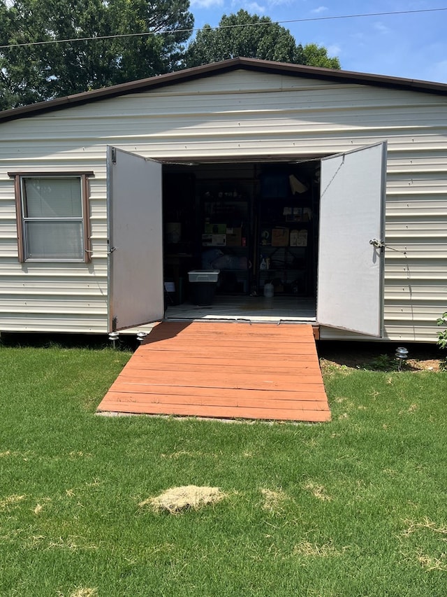 view of outdoor structure with a lawn