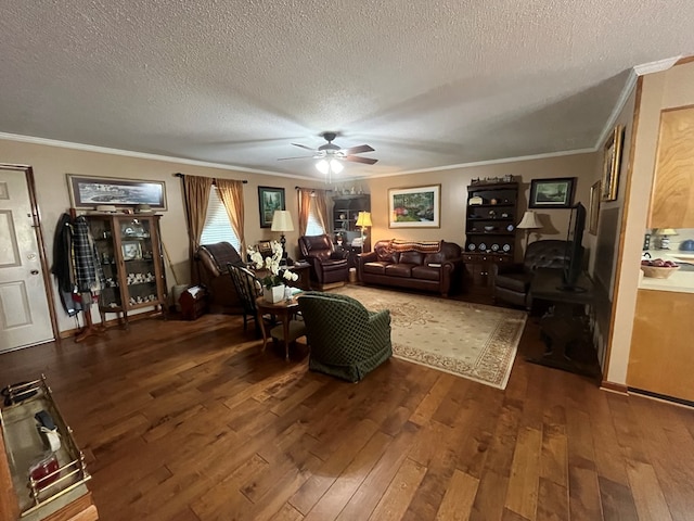 living room with crown molding, dark wood-type flooring, a textured ceiling, and ceiling fan