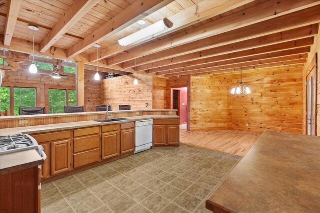 3691 Flagpole Rd, Ellijay, GA 30540 - kitchen with dishwasher, a sink, wooden walls, pendant lighting, and wood ceiling with exposed beams
