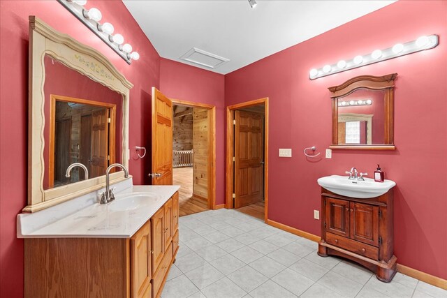 3691 Flagpole Rd, Ellijay, GA 30540 - bathroom with two vanities, baseboards, and tile patterned flooring