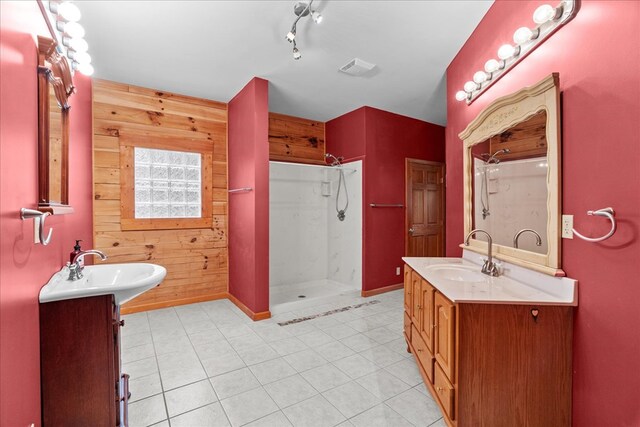 3691 Flagpole Rd, Ellijay, GA 30540 - full bathroom with wood walls, a stall shower, two vanities, baseboards, and tile patterned floors