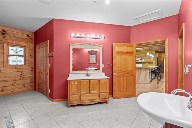 3691 Flagpole Rd, Ellijay, GA 30540 - full bathroom featuring wood walls, a sink, tile patterned floors, and baseboards