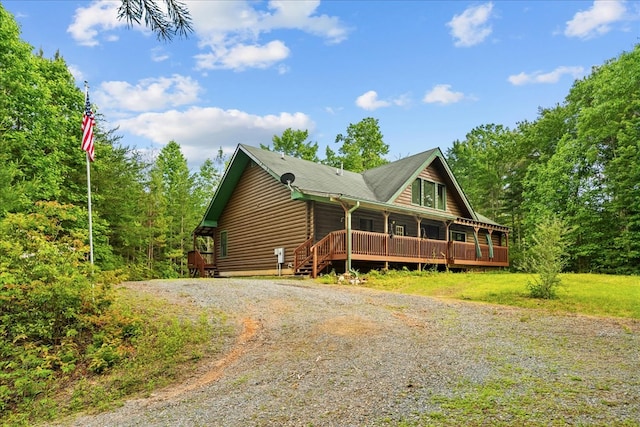 3691 Flagpole Rd, Ellijay, GA 30540 - log cabin with gravel driveway and covered porch