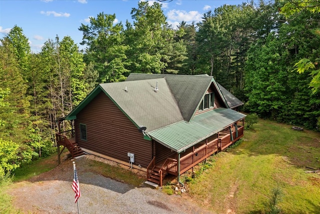 3691 Flagpole Rd, Ellijay, GA 30540 - view of side of property featuring stairs, a wooded view, a yard, and metal roof