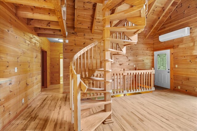 3691 Flagpole Rd, Ellijay, GA 30540 - stairs with wood walls, wood ceiling, a wall mounted AC, and wood finished floors