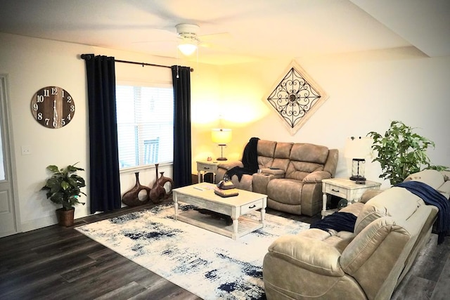 living room featuring dark hardwood / wood-style flooring and ceiling fan