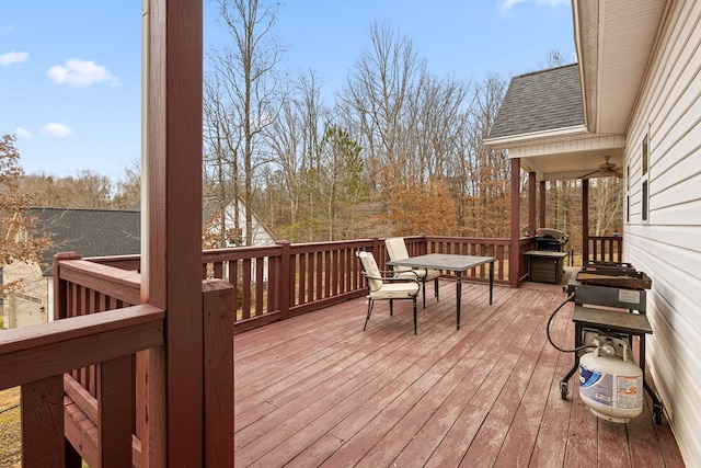 wooden terrace featuring outdoor dining space