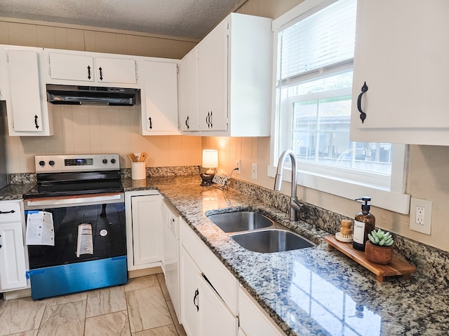 106 Santa Fe Trl NW, Dalton, GA 30721 - kitchen with stainless steel electric stove, under cabinet range hood, white cabinetry, dark stone countertops, and light marble finish floors