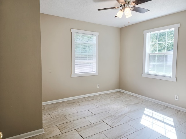 106 Santa Fe Trl NW, Dalton, GA 30721 - spare room with ceiling fan, marble look tile flooring, and a textured ceiling