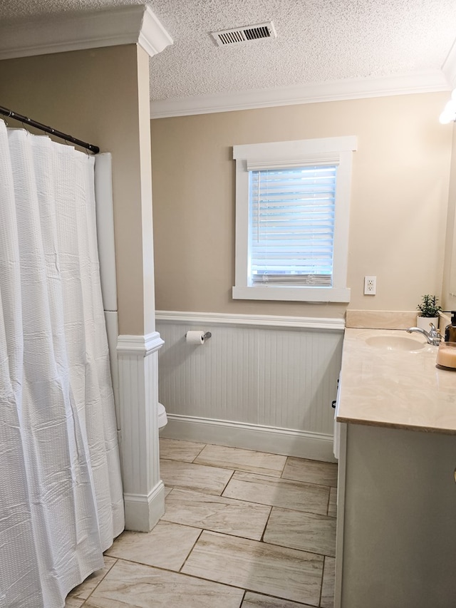 106 Santa Fe Trl NW, Dalton, GA 30721 - bathroom with ornamental molding, vanity, a wainscoted wall, a textured ceiling, and curtained shower
