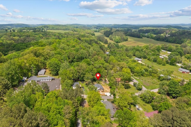 bird's eye view featuring a forest view