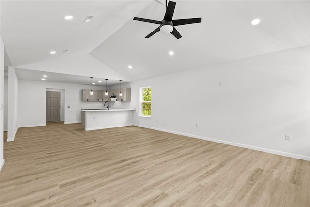 unfurnished living room with recessed lighting, a ceiling fan, and light wood-style floors