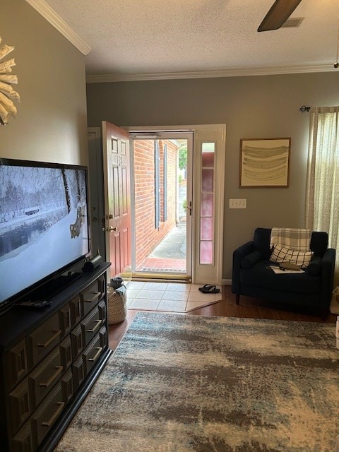 1698 Pin Oak Dr Unit 128, Dalton, GA 30721 - tiled entryway featuring ornamental molding, ceiling fan, and a textured ceiling