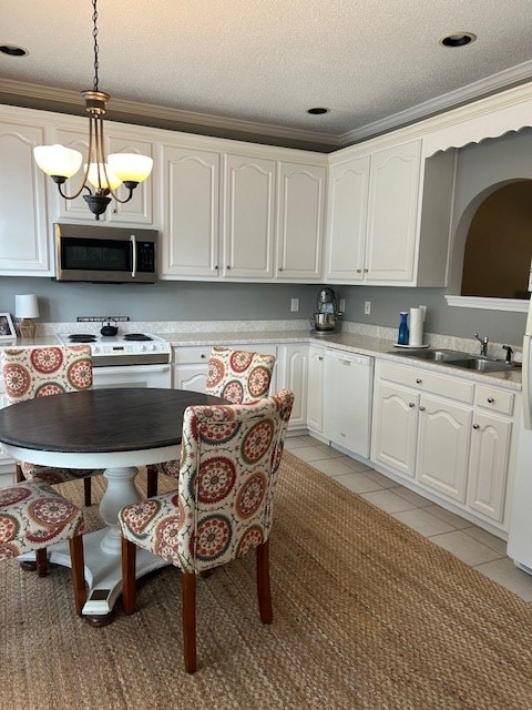 1698 Pin Oak Dr Unit 128, Dalton, GA 30721 - kitchen with white appliances, a sink, decorative light fixtures, light tile patterned floors, and a textured ceiling